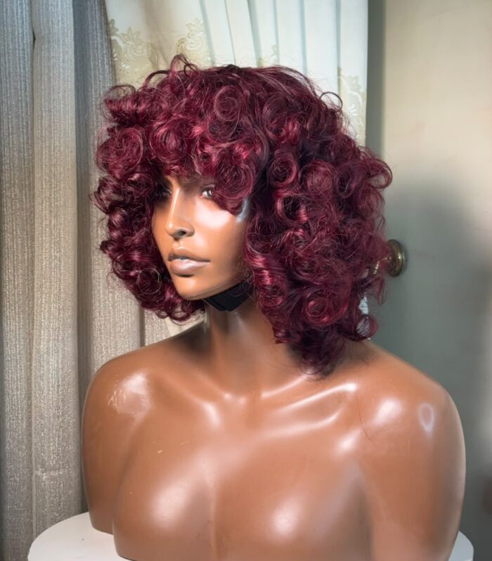 Turn heads and make a bold statement with our Burgundy Curl Bomb Wig—the ultimate blend of fierce sophistication and effortless glam