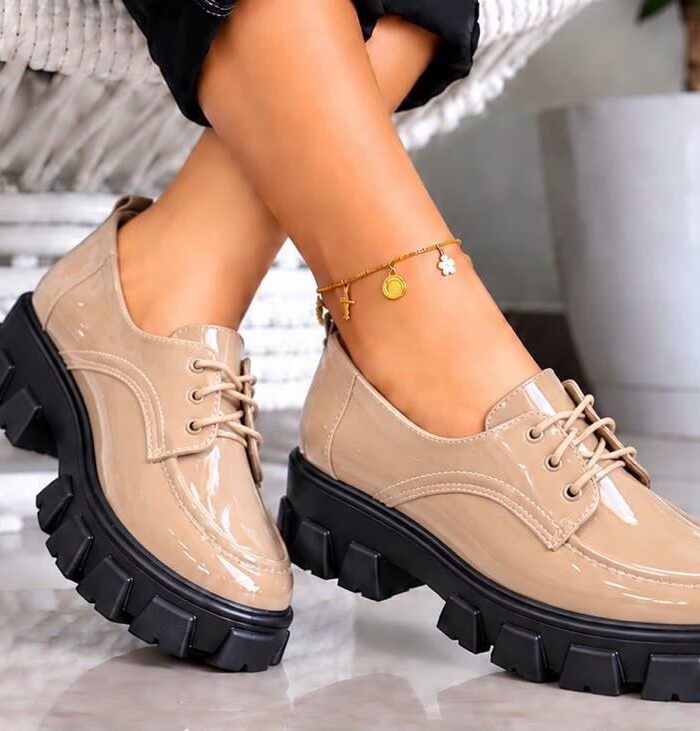 Step up your style with these trendy Women’s Nude Patent Leather Chunky Platform Loafers! Combining classic lace-up oxford design with a modern, edgy platform sole, these shoes offer the perfect balance of comfort, height, and high-fashion appeal.