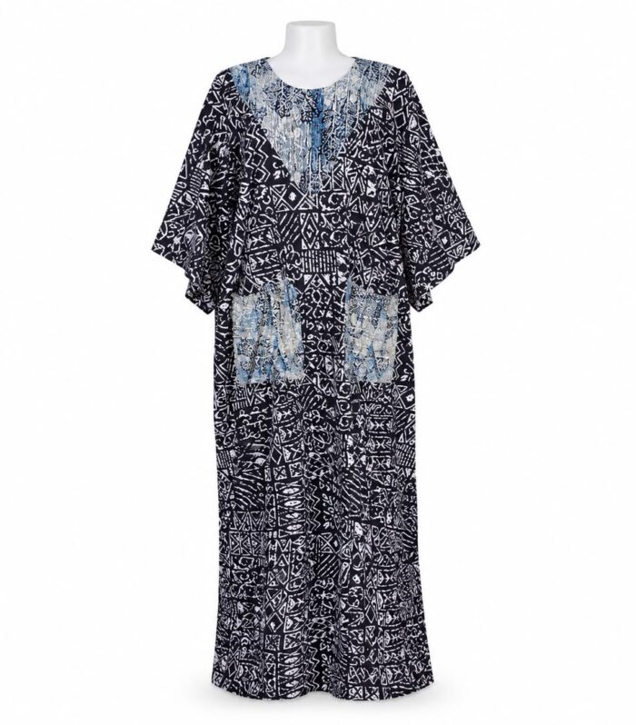 Make an effortless statement with this full-length monochrome kaftan dress. Featuring a geometric, tribal-inspired batik print in black and white, this piece combines striking contrast with an easygoing silhouette.